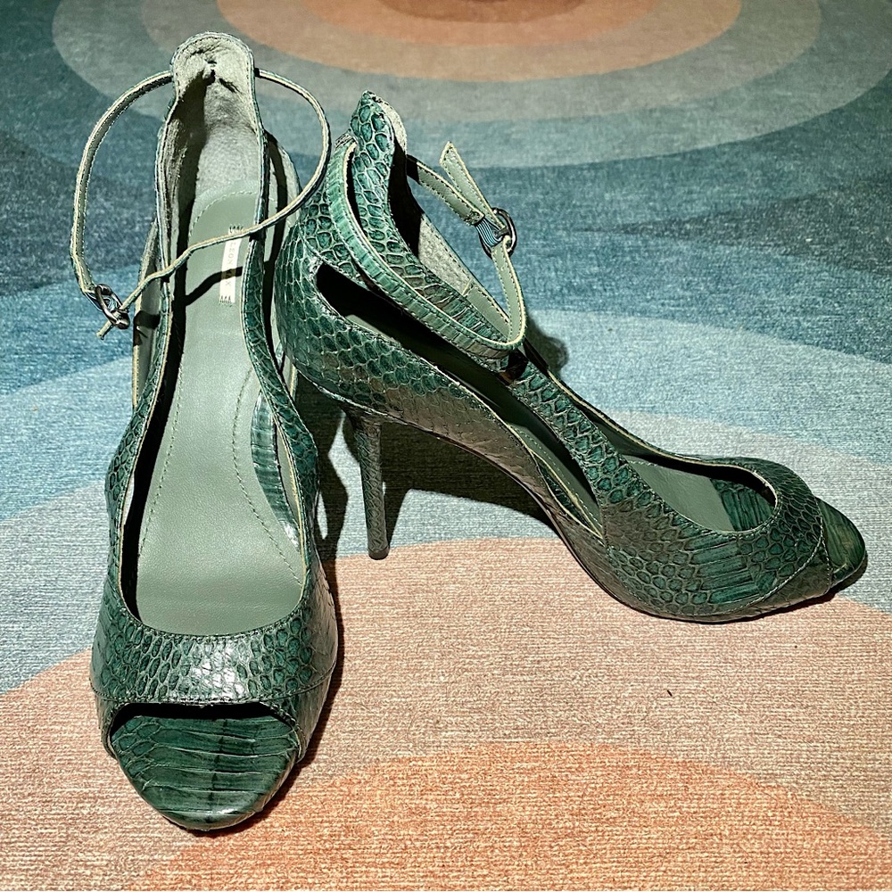 Dark green Leon Max snakeskin stilettos.